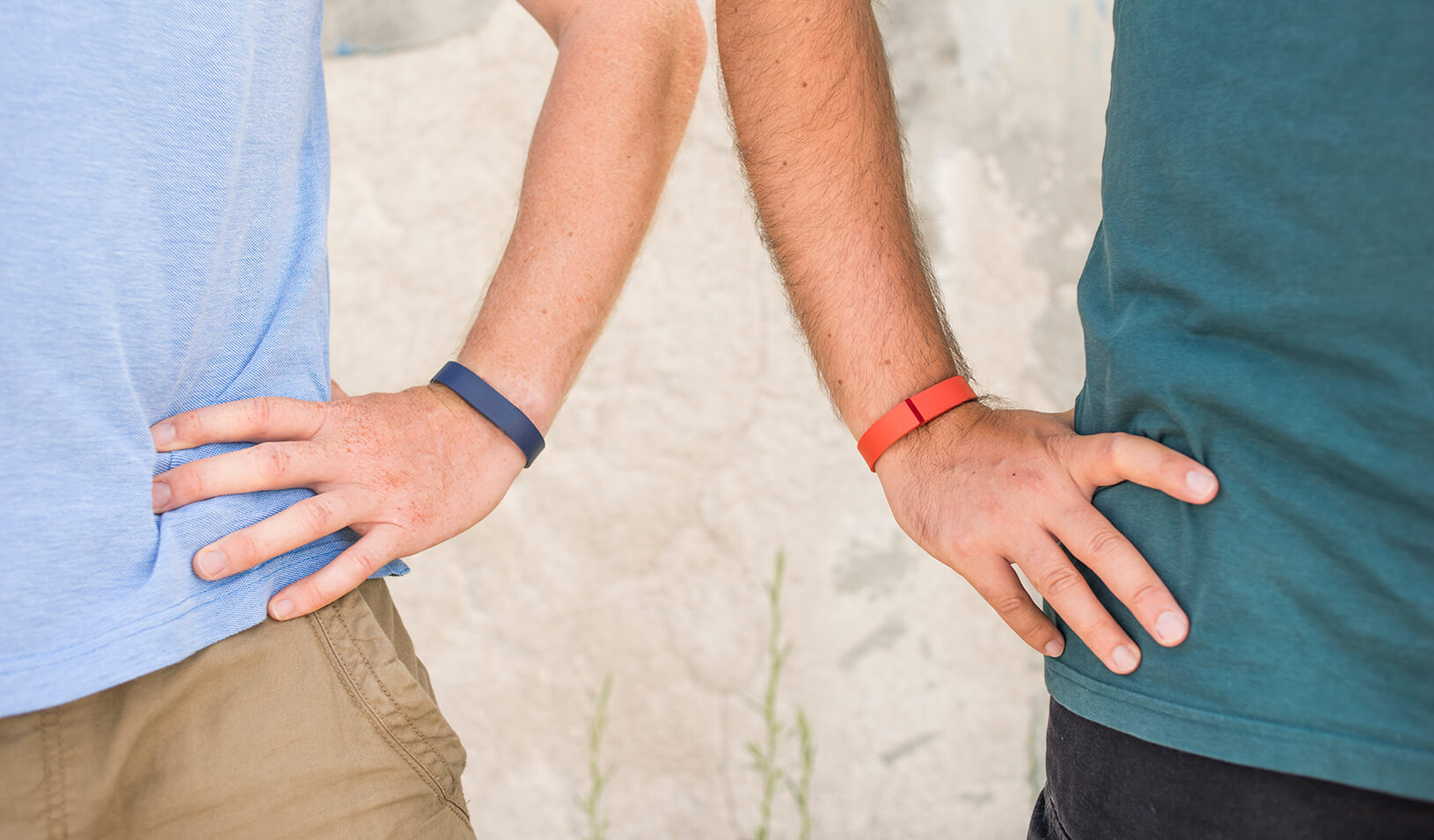 Two men standing with hands on hips | iStock/ Christopher Ames