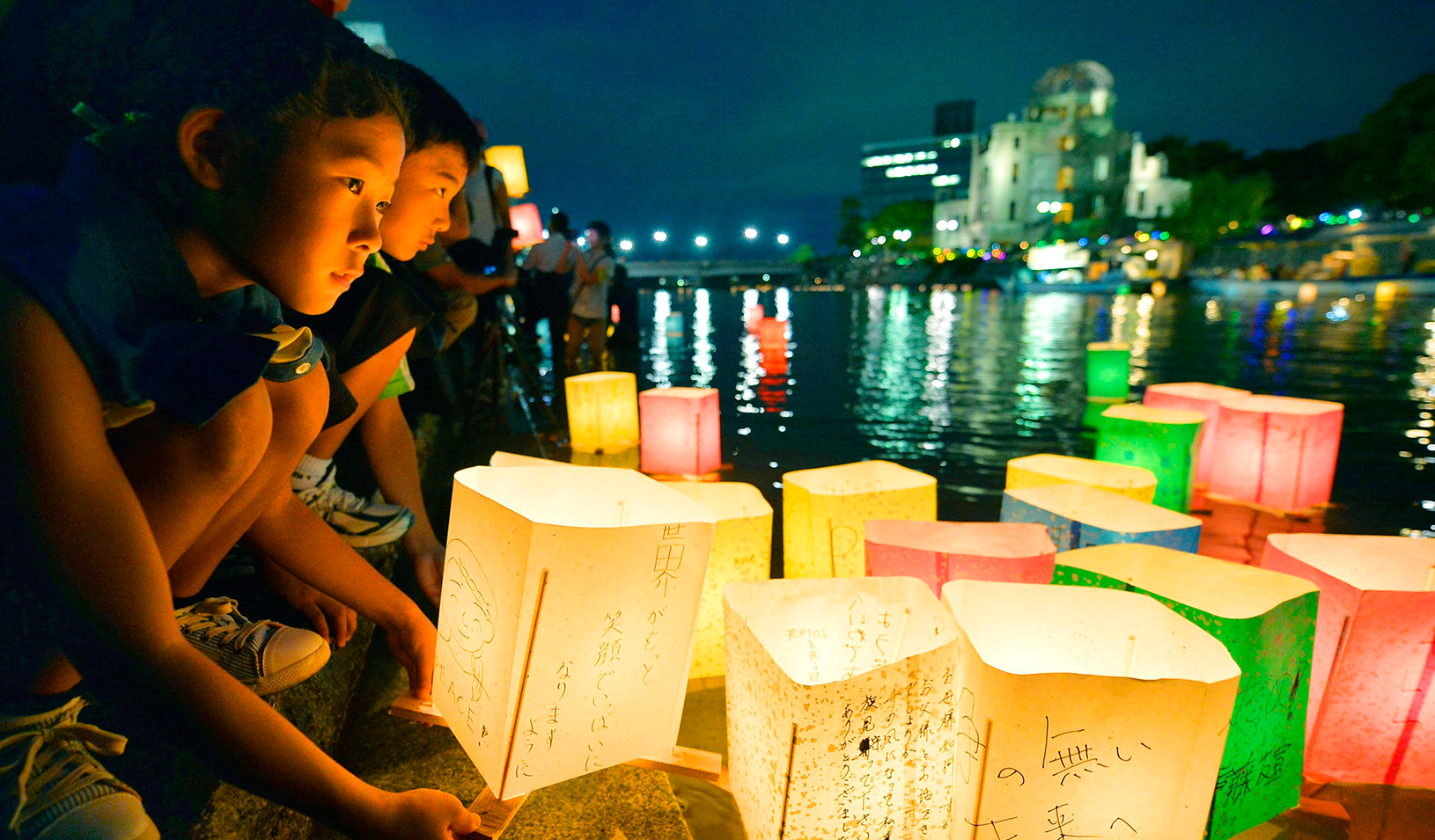 People release paper lanterns  in the river
