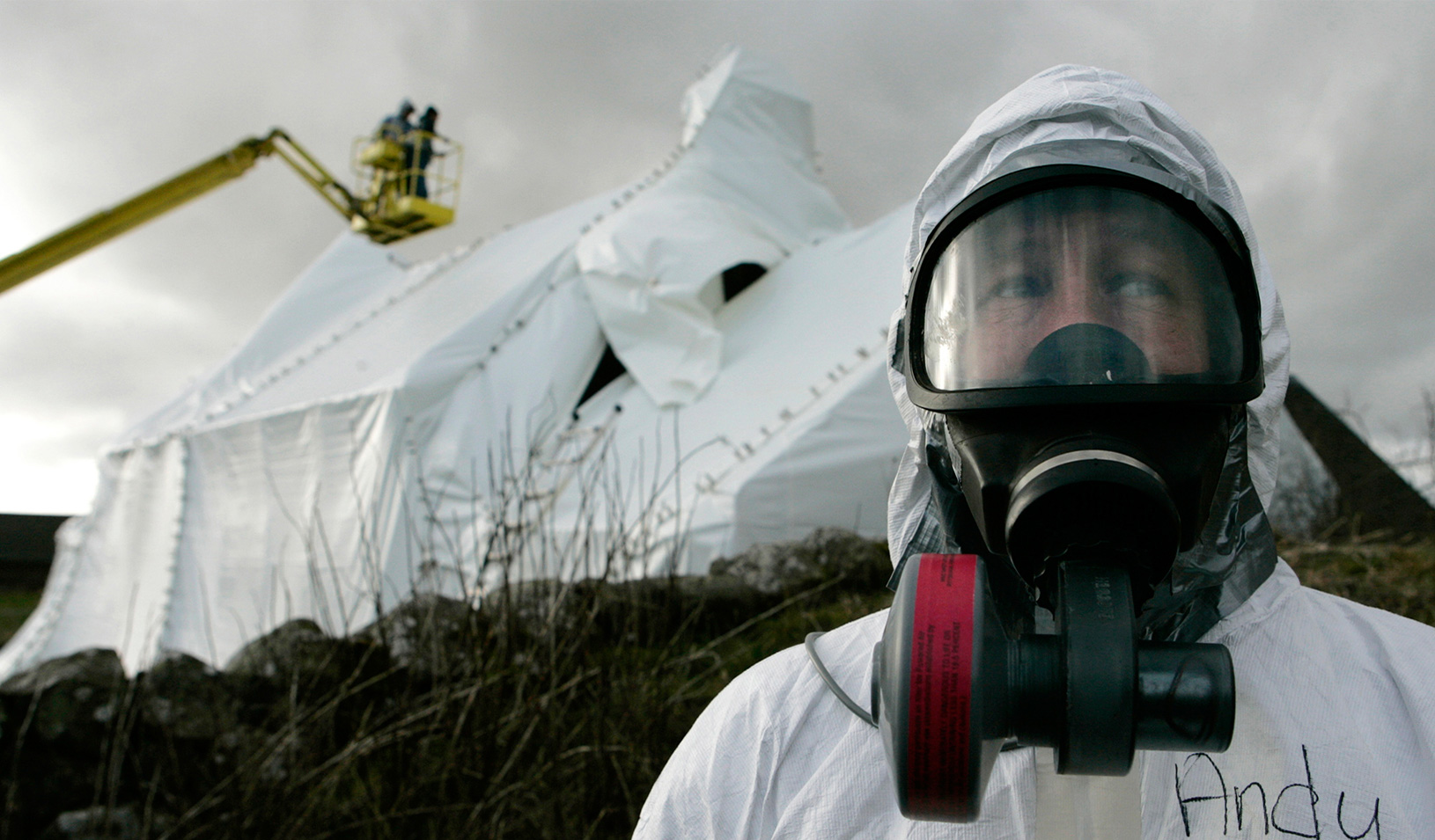 A man wearing protective gear in a decontamination site