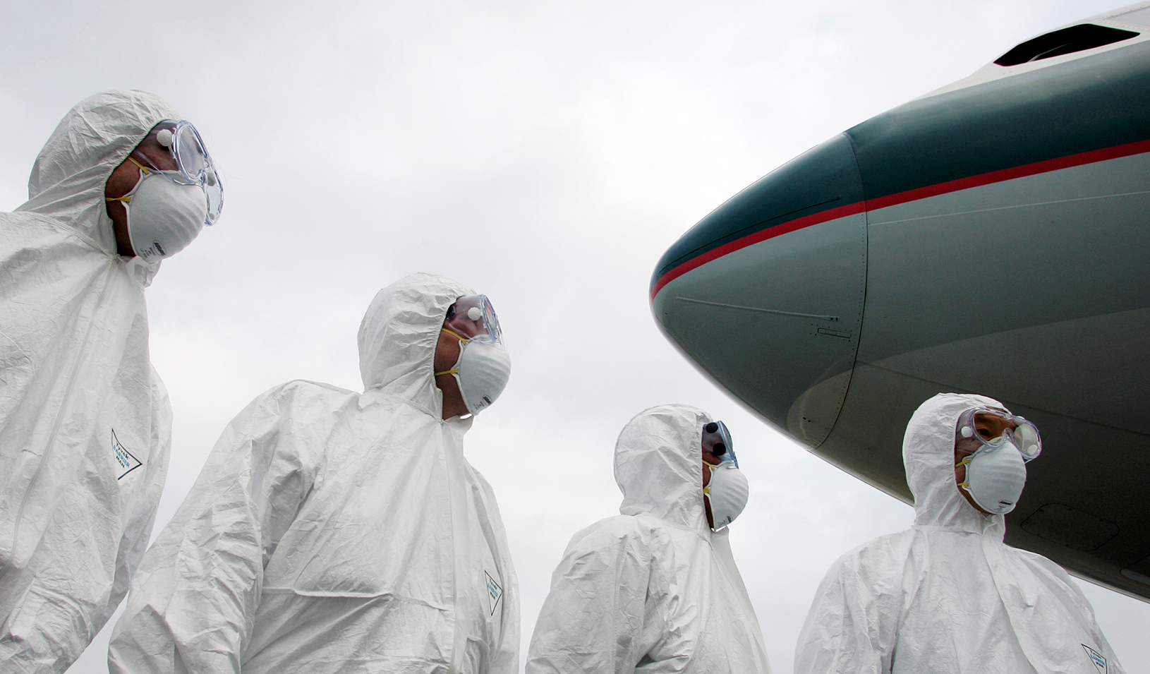 Members of Hong Kong's Health Department participate in a simulation exercise at the Hong Kong International Airport March 17, 2006 | Reuters/Alex Hofford/Pool