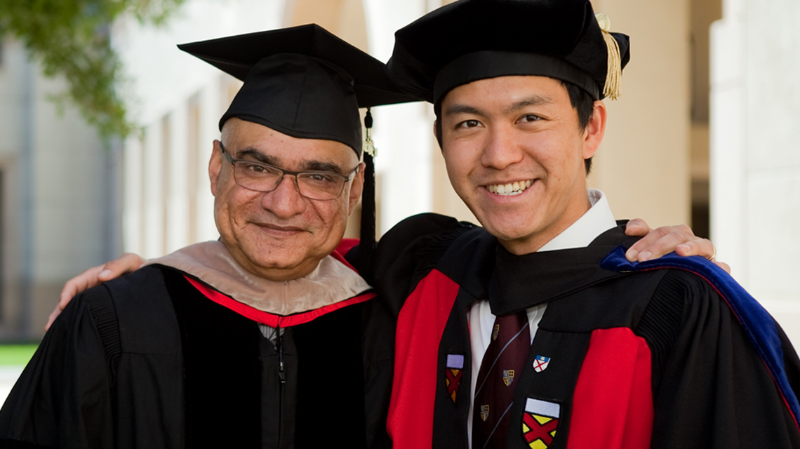 Professor Baba Shiv with PhD graduate at commencement