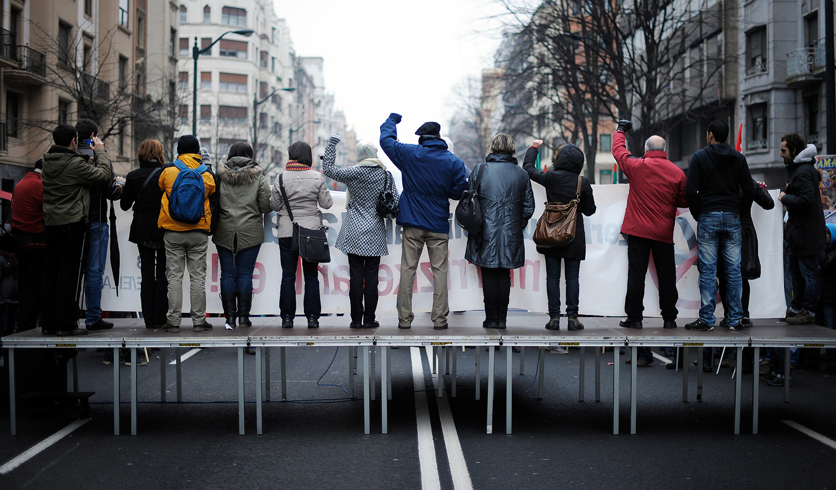 Protestors on a platform in the middle of a street | Reuters/Vincent West
