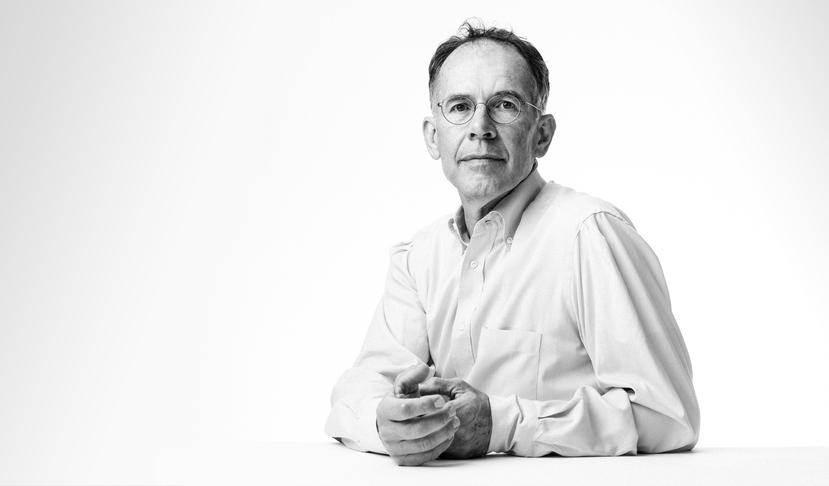 A black and white photograph of Guido Imbens, the Applied Econometrics Professor and Professor of Economics at Stanford GSB. | Credit: Elena Zhukova.