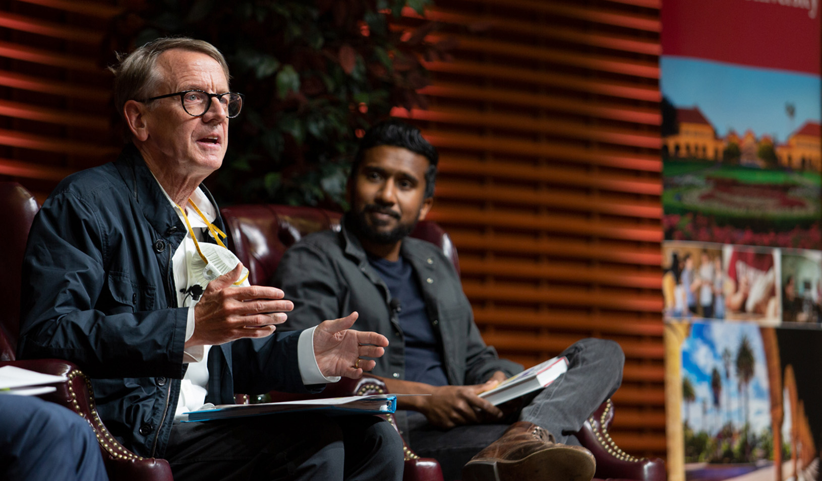 John Doerr on stage at Stanford GSB, talking to an audience about his plan for climate action. Photo by Saul Bromberger