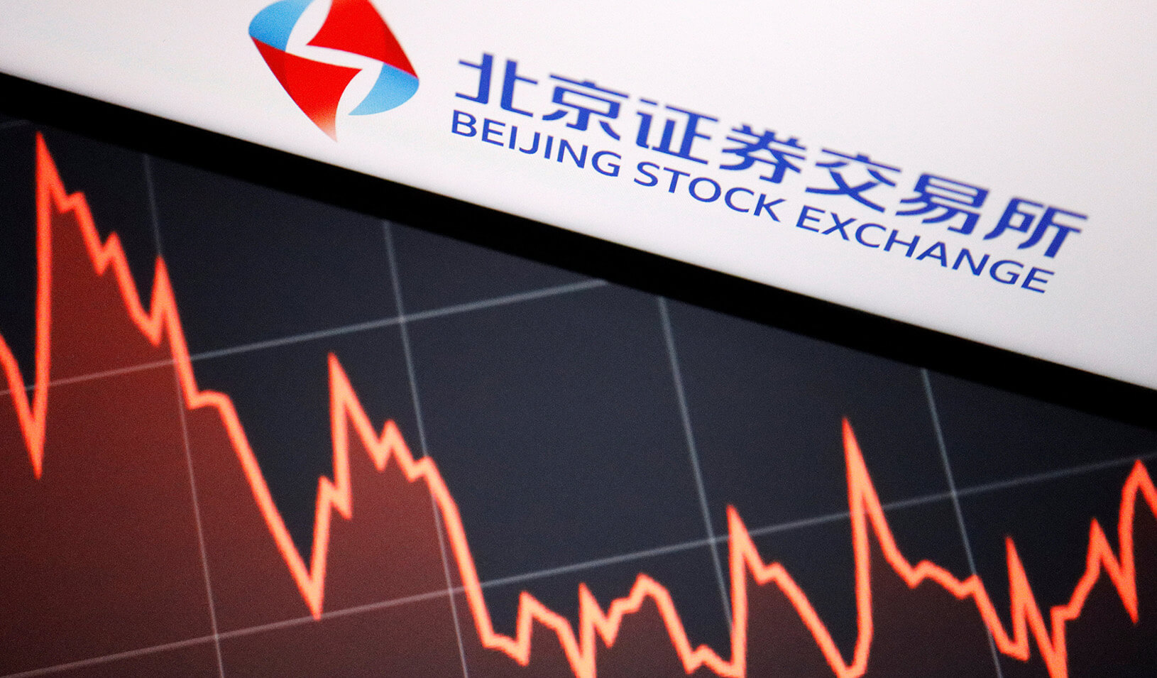 Illustration of the Beijing stock exchange logo next to a declining graph. Reuters/Florence Lo