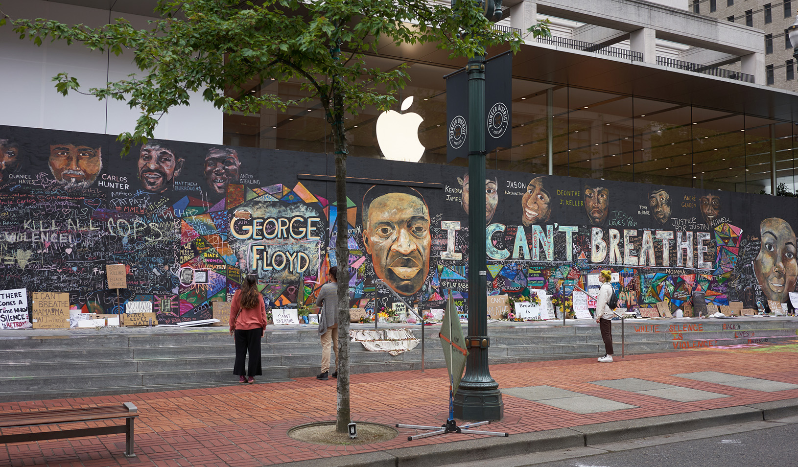 An apple store in Downtown Portland with boarded up signs that have been painted with Black Lives Matter. iStock/hapabapa