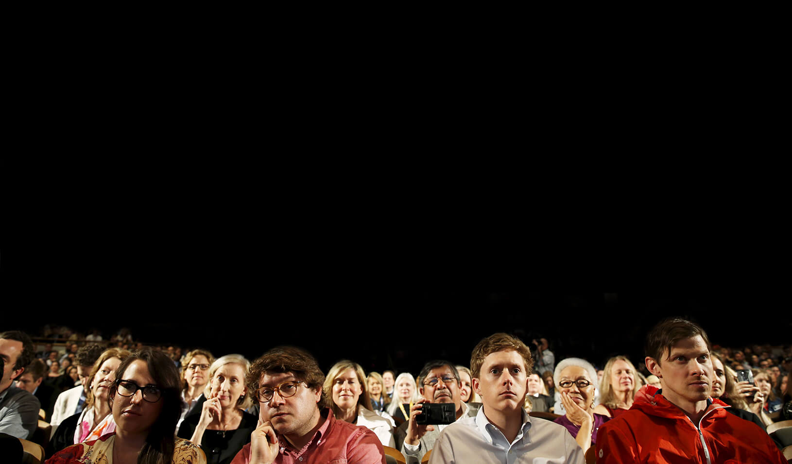 People in the audience look on as U.S. President Barack Obama participates in an onstage interview | Reuters/Jonathan Ernst