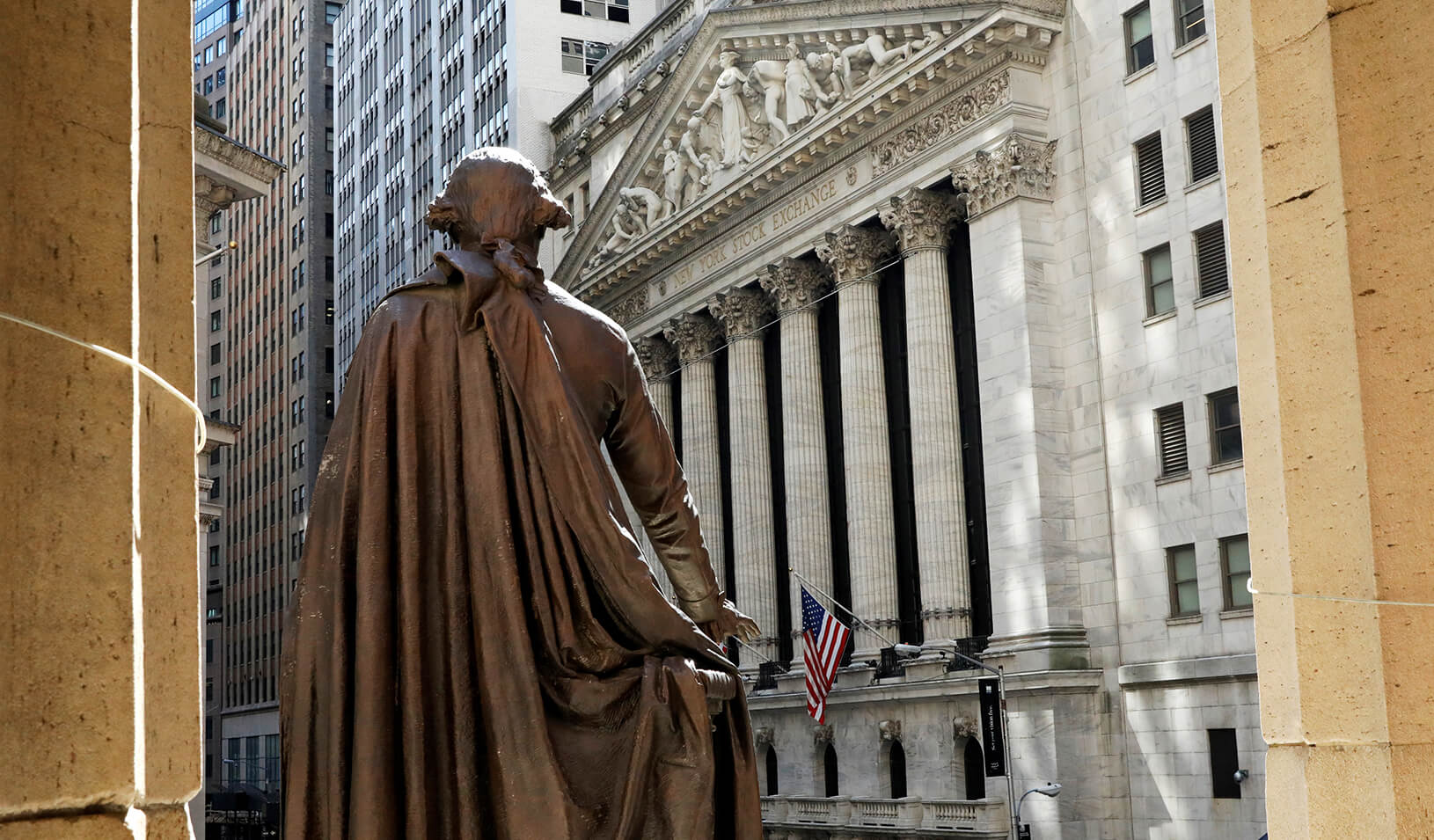 The New York Stock Exchange from the steps of Federal Hall behind a statue of former U.S. President George Washington. | Reuters/Brendan McDermid