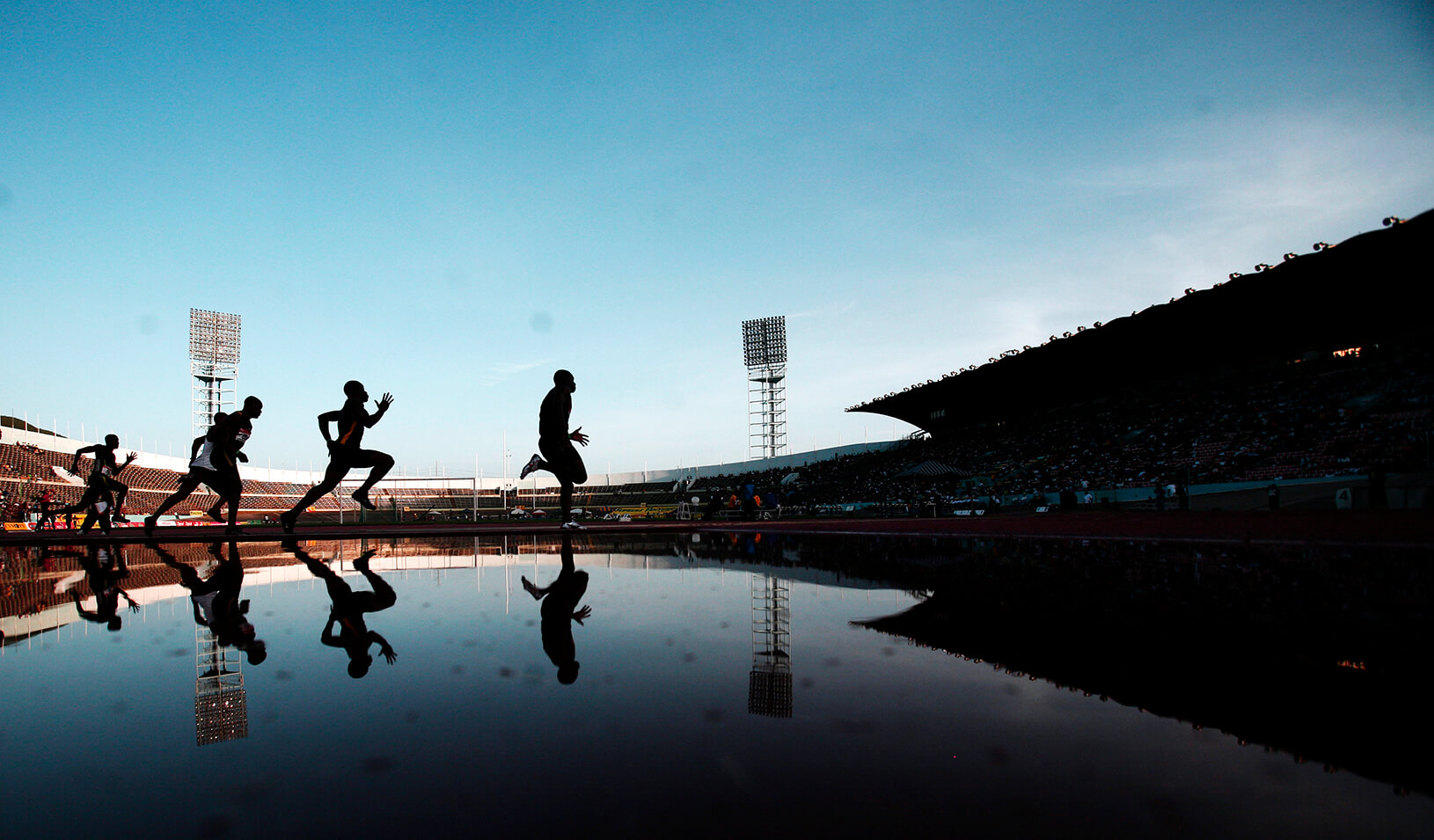  Jamaican athletes compete in the men's 200 meters race. | Reuters/Carlos Barria