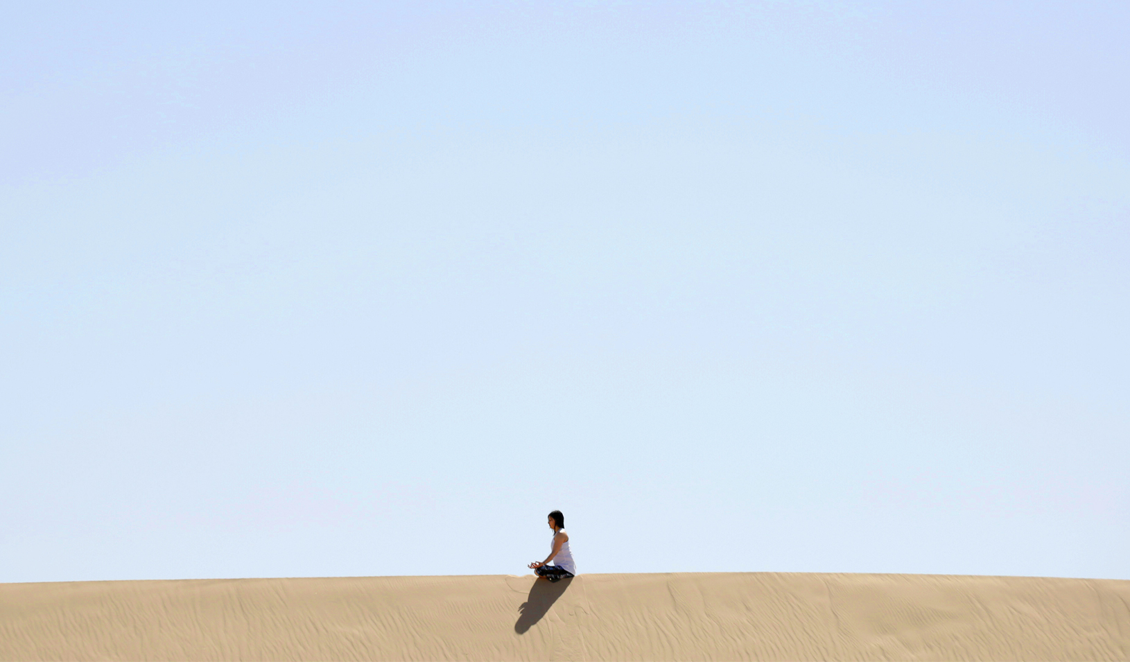 A yoga enthusiast rests after a class at the Samalayuca dunes, on the outskirts of Ciudad Juarez, Mexico. Credit: Reuters/Jose Luis Gonzalez