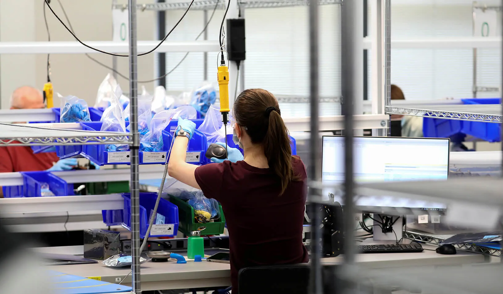 An employee works to make ventilators at the General Motors Components Holding Plant that is manufacturing ventilators for use during the coronavirus disease outbreak. Credit: Reuters/Chris Bergin
