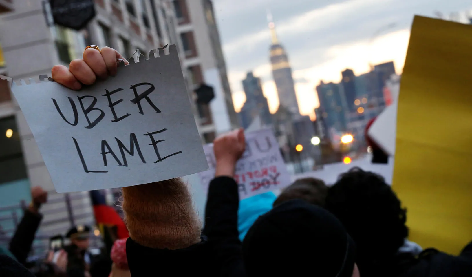 People gather to protest outside the Uber offices in Queens, New York. | Reuters/Brendan McDermid