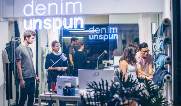 Walden Lam and others create denim products in their workshop space. Credit: Courtesy of Unspun