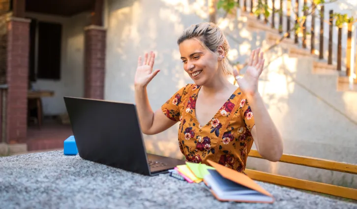 A woman giving a presentation online from her home. Credit: iStock/