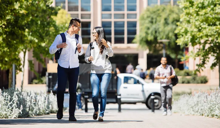 Students walking in front of Stanford GSB campus. Credit: Elena Zhukova