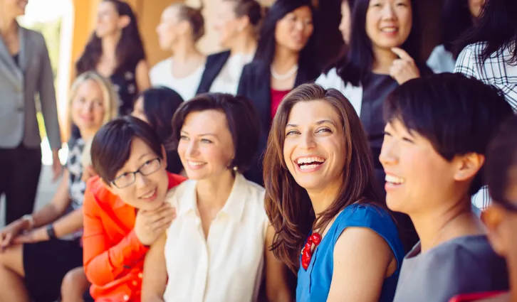 Two women talk together at the Accelerate women’s leadership program at Stanford GSB. Credit: Tricia Seibold