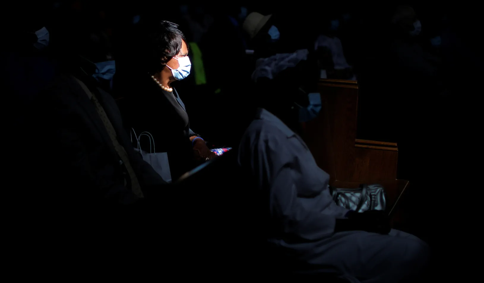 A worshipper wears a required face mask during the reopening for in-person church services after nearly 18 months of virtual services because of the coronavirus disease (COVID-19). REUTERS/Brian Snyder.