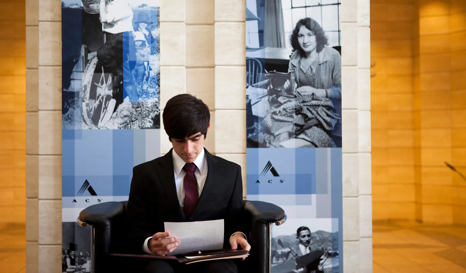 A student looks over his resume as he waits for an interview in Los Angeles (Reuters photo by Patrick T. Fallon)